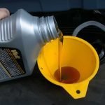 motor-oil-refill-with-yellow-funnel.jpg